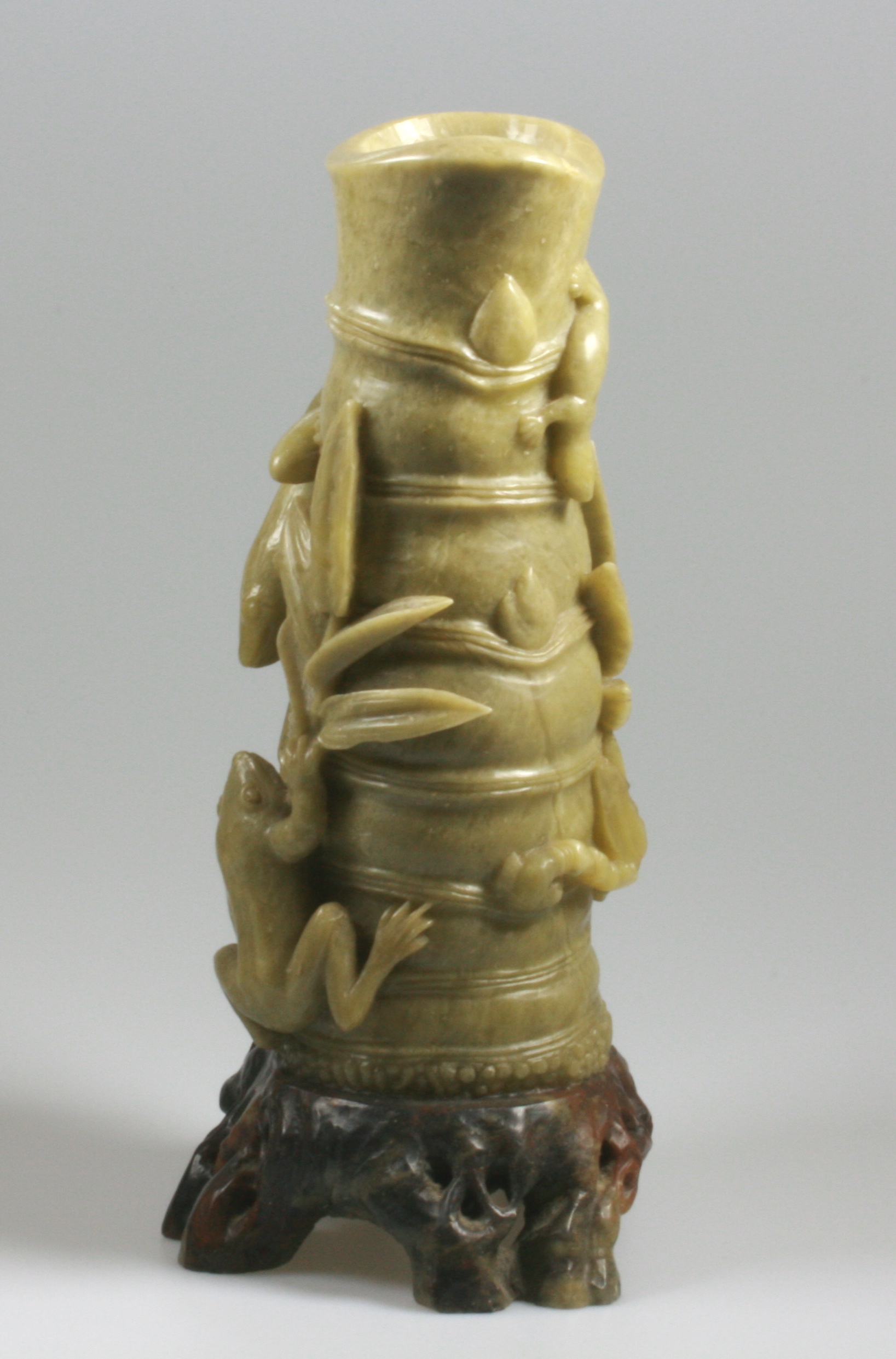A Chinese Soapstone Brush Holder. 19th century. Carved in the form of bamboo stalks with climbing