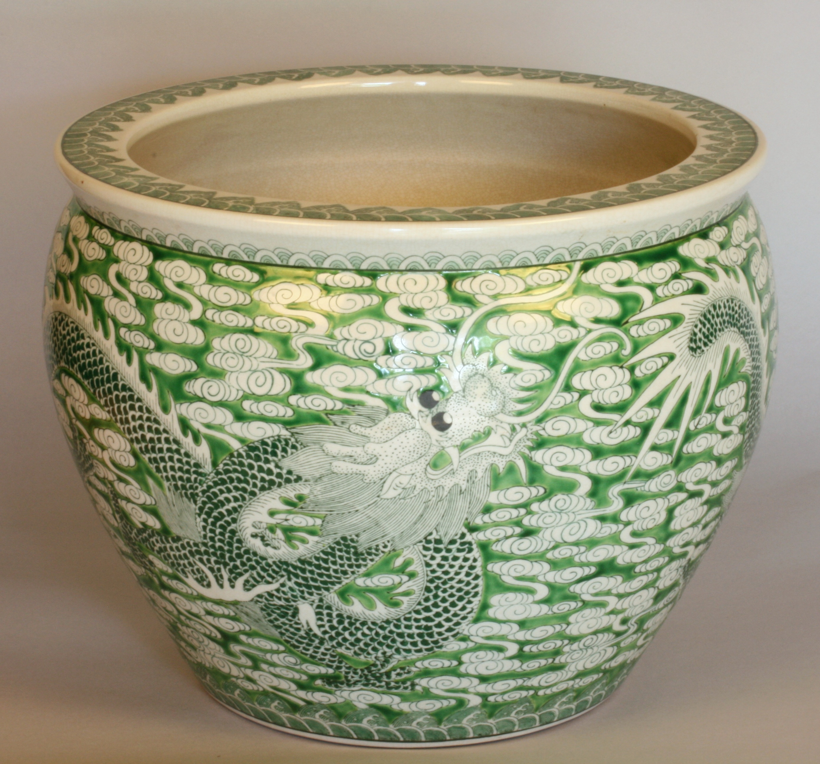 A Chinese Carp Bowl. Youngzou Circa 1880. Decorated in green with a Dragon. The interior with