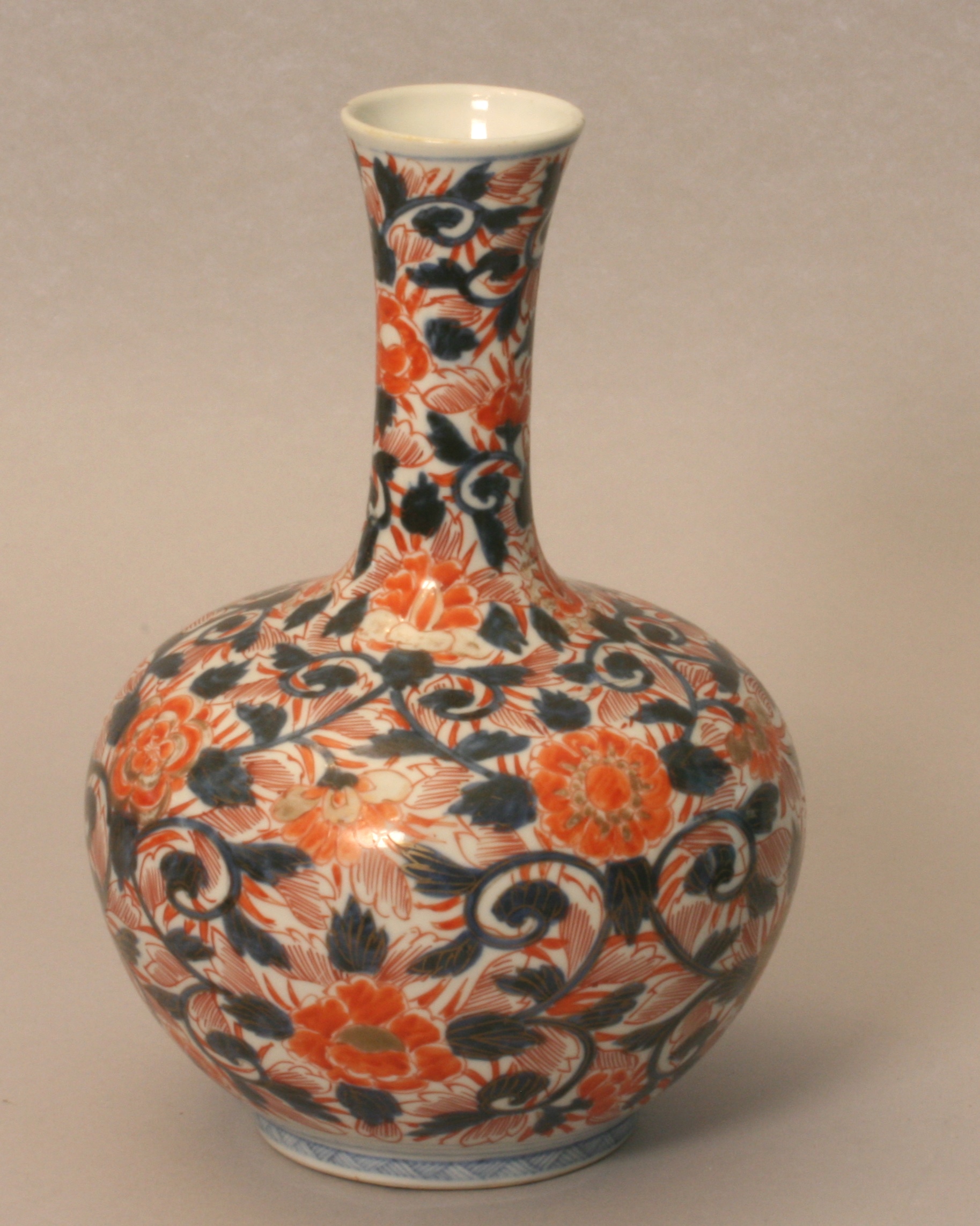 A Japanese Imari Vase. Meiji Period (1868-1912). Of squat ovoid form with long slender  neck. 26cm