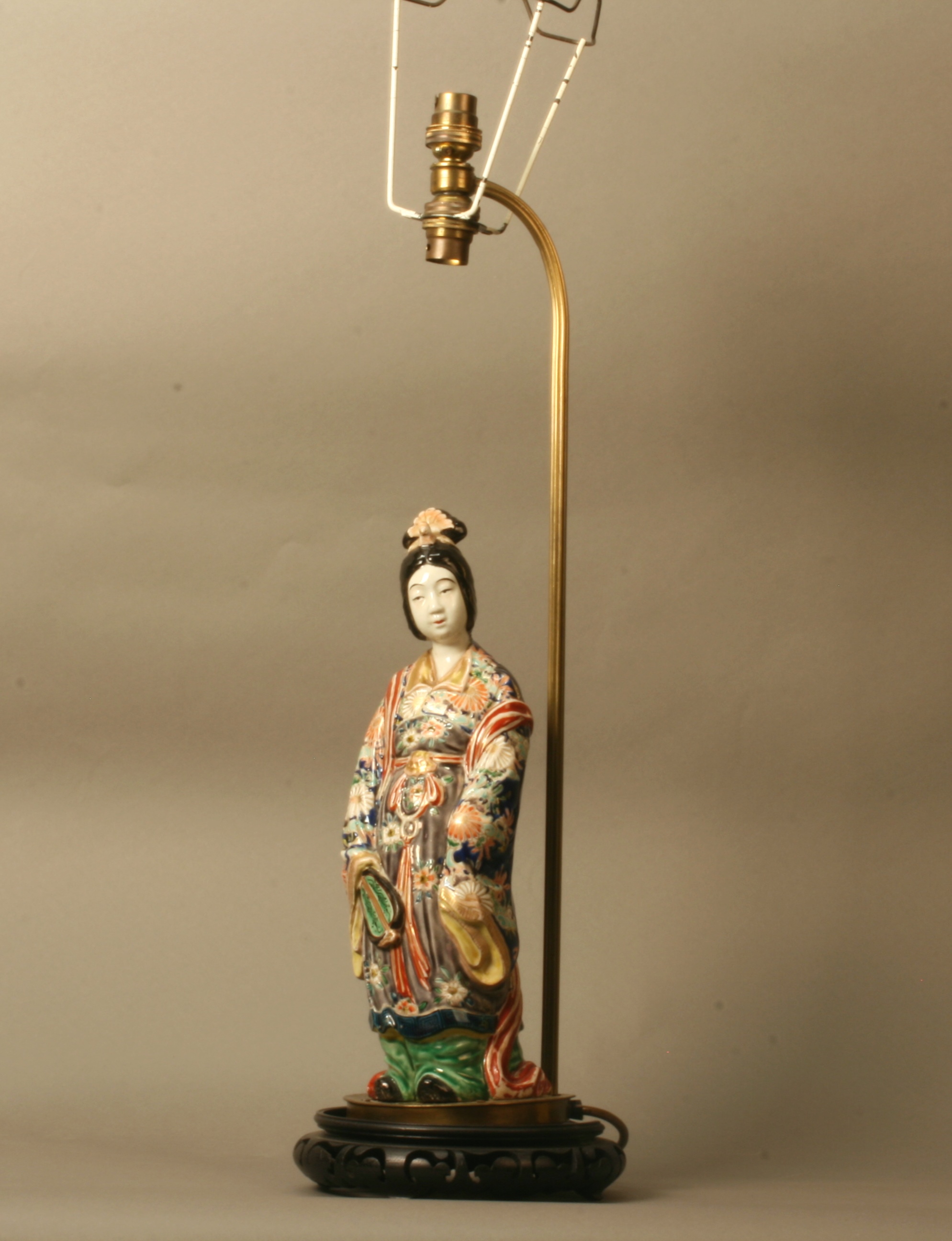 An Oriental  Polychrome Porcelain Lamp. Early 20th century. Modelled as a  Lady in long flowing