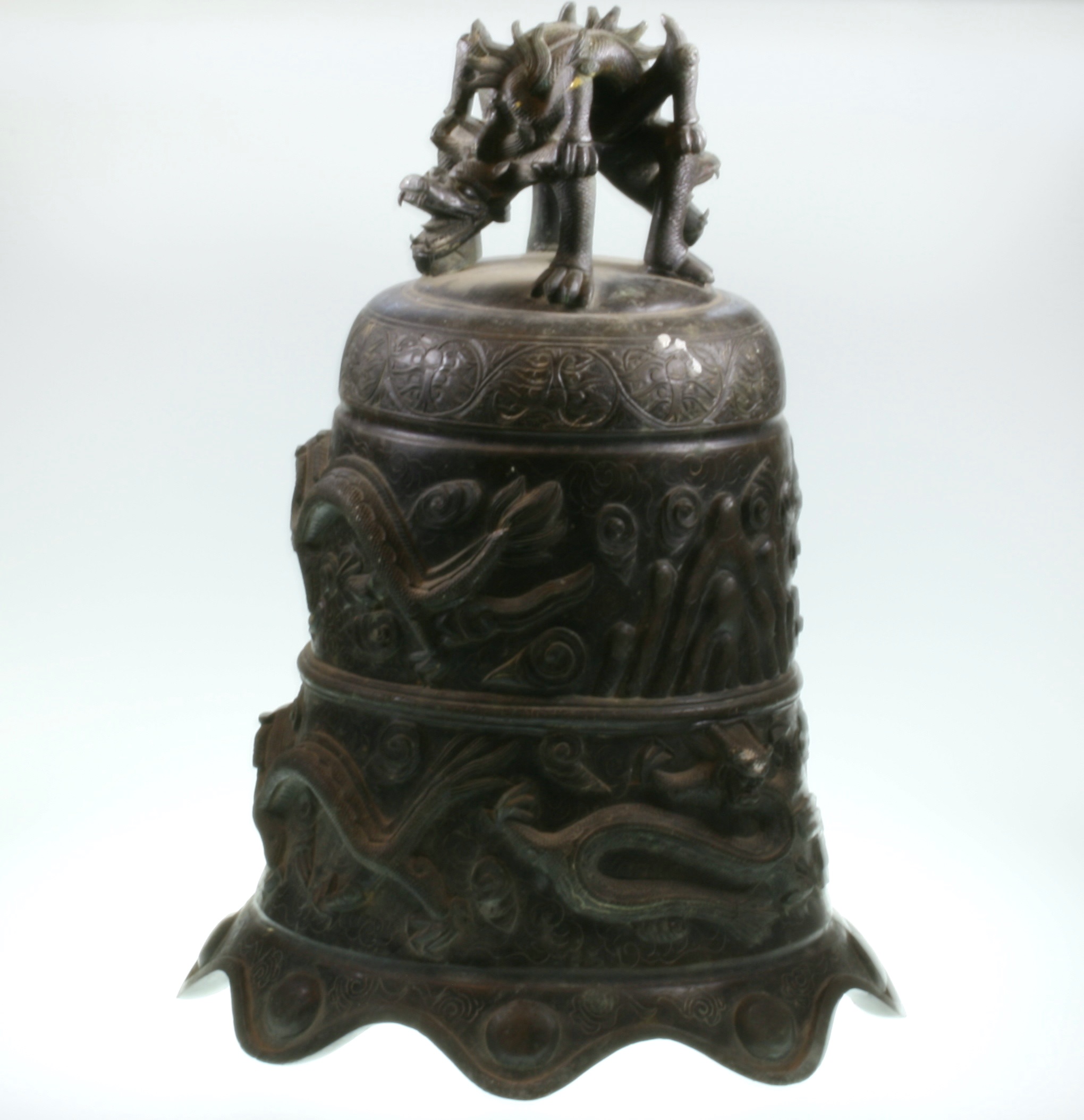 An Oriental Antique Bronze Temple Bell. 19th century or older. Cast with dragons amidst cloud