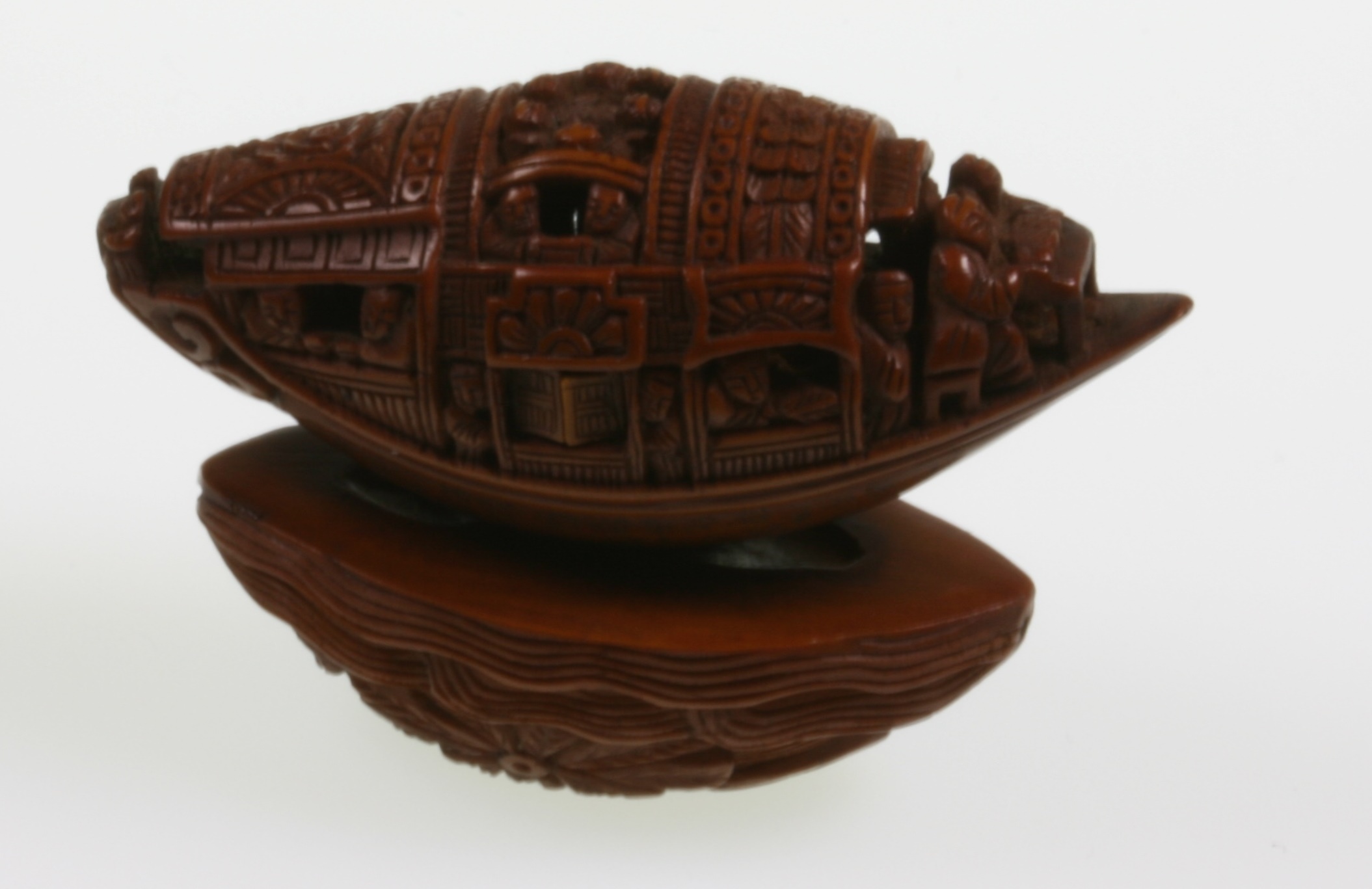A Rare Chinese Imperial Carved Heidao Nut Hard Pip Seed Miniature Sampan & Stand Pomegranate. 19th