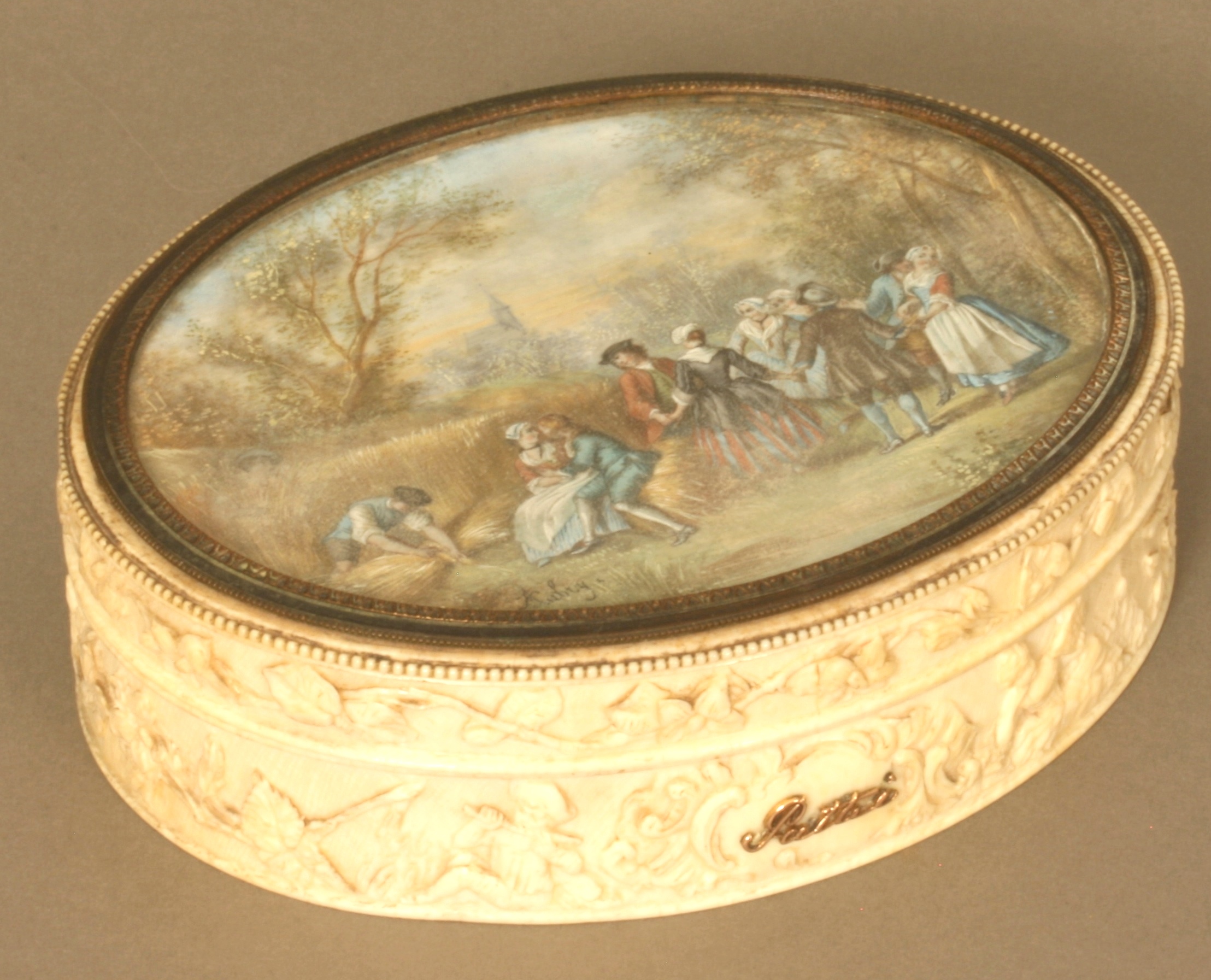 A Fine  French Ivory Oval Jewellery box. Late 18th century.The lid painted with a pastoral scene