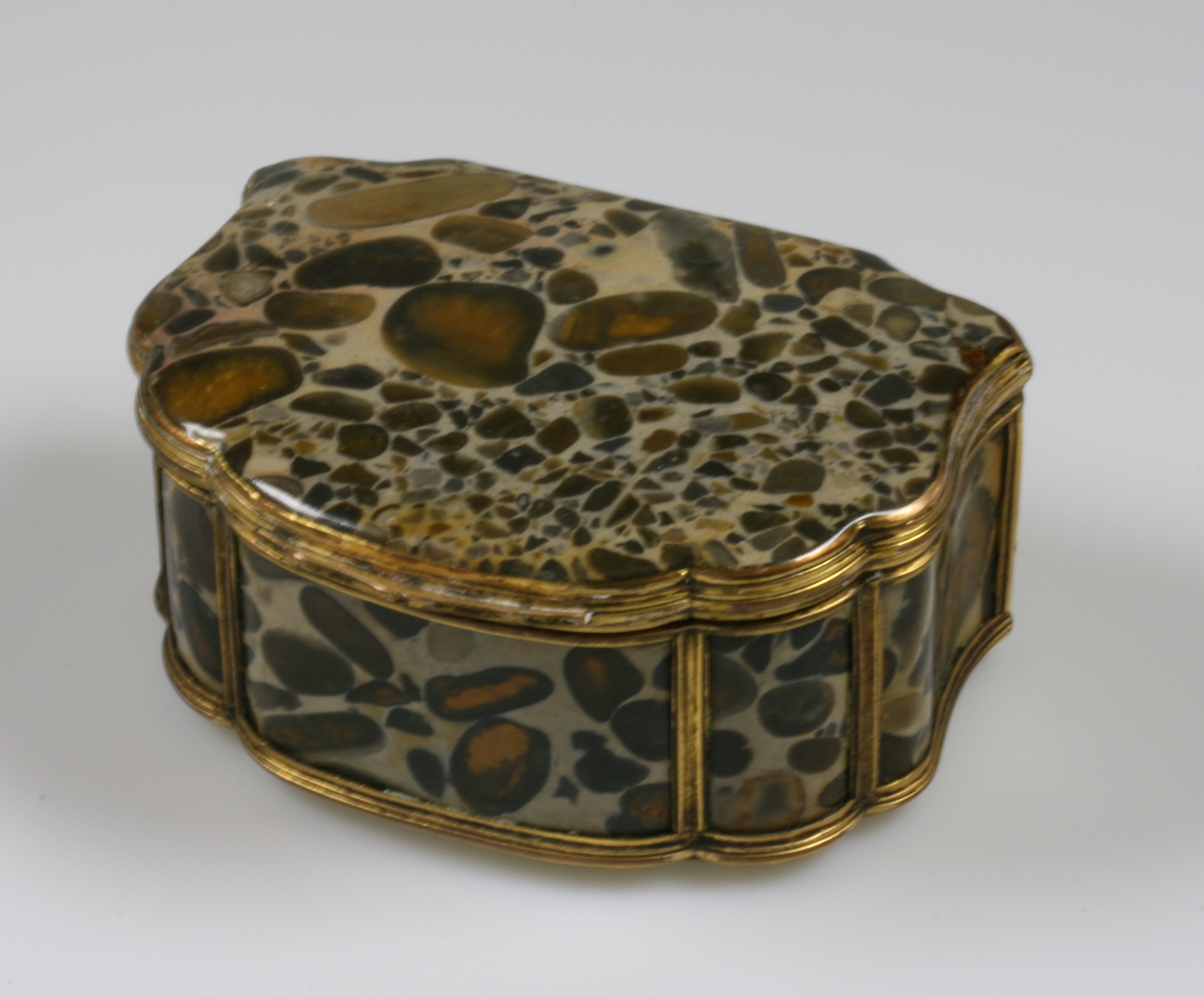 A Fine Matrix Agate of Gilt Metal Box. 19th century. Of shaped rectangular form with hinged cover.