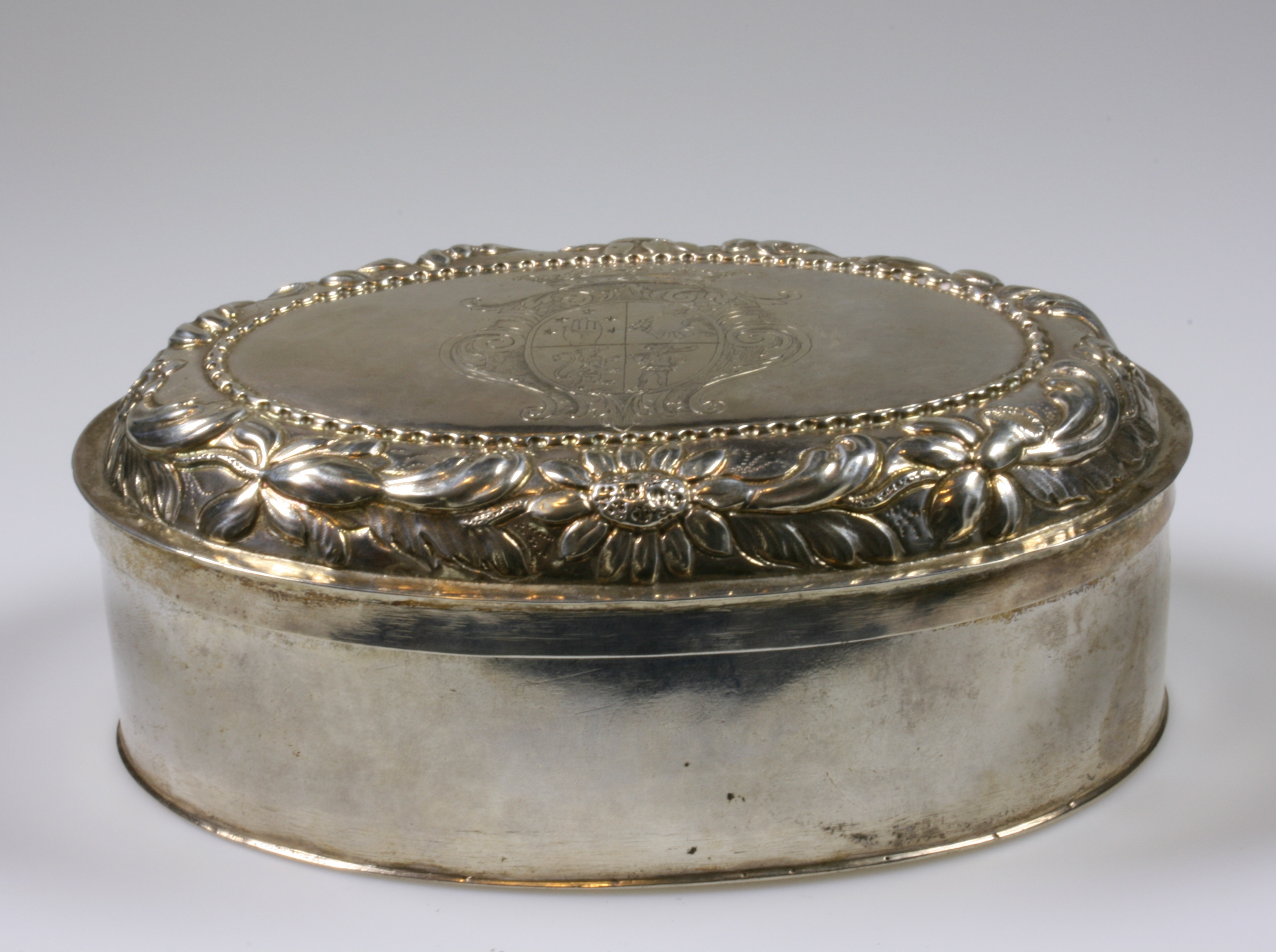 An Antique Silver Oval Box and Cover. Possibly German 18th century. The detachable cover engraved