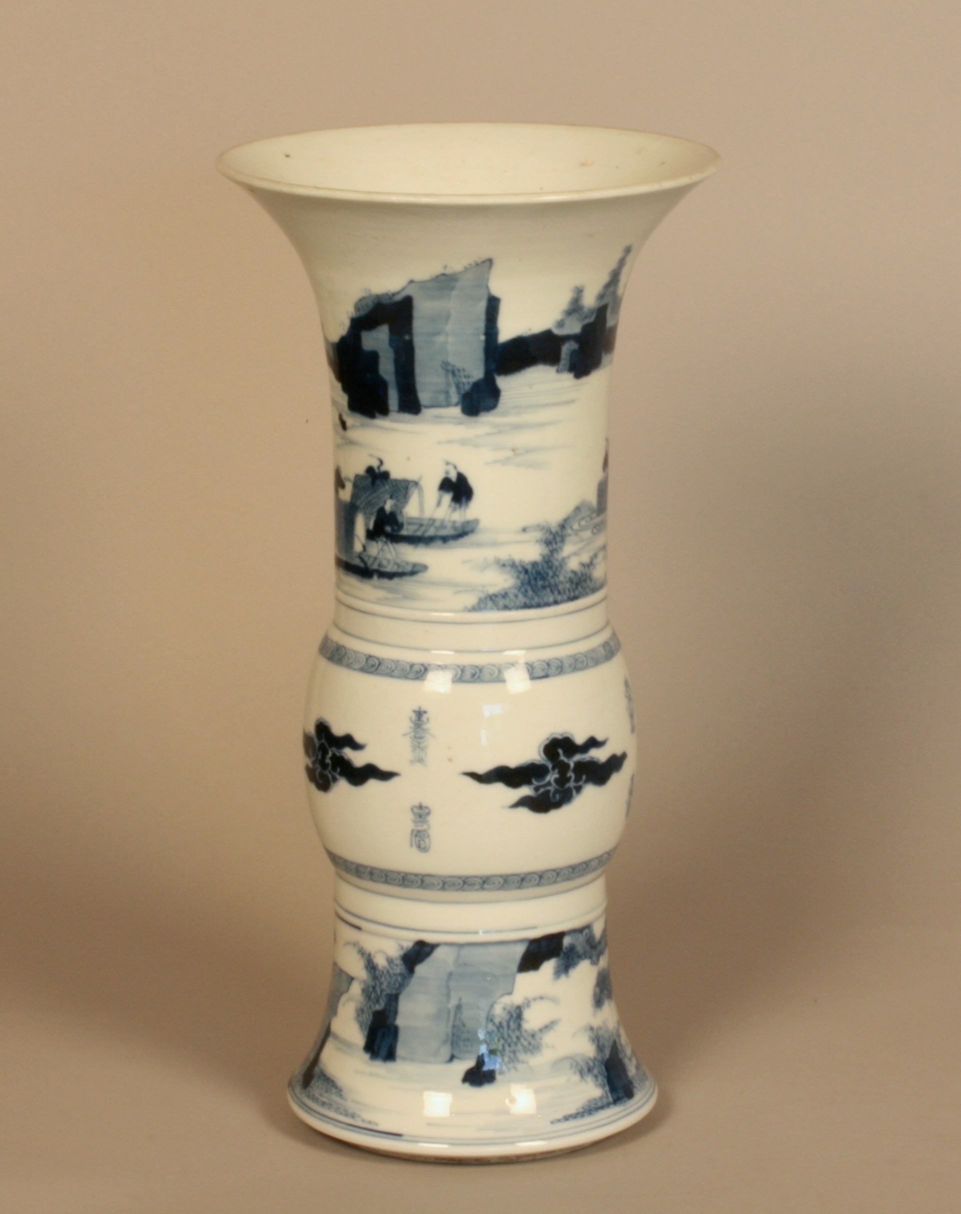 A Chinese Blue and White Vase. 19th century. Of slender bulbous cylindrical form with flared rim.