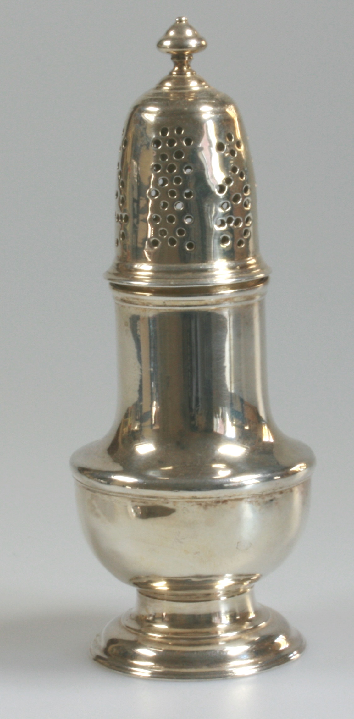 A George II Silver Pepper Caster. Samuel Wood, London 1750. Of typical form with pierced