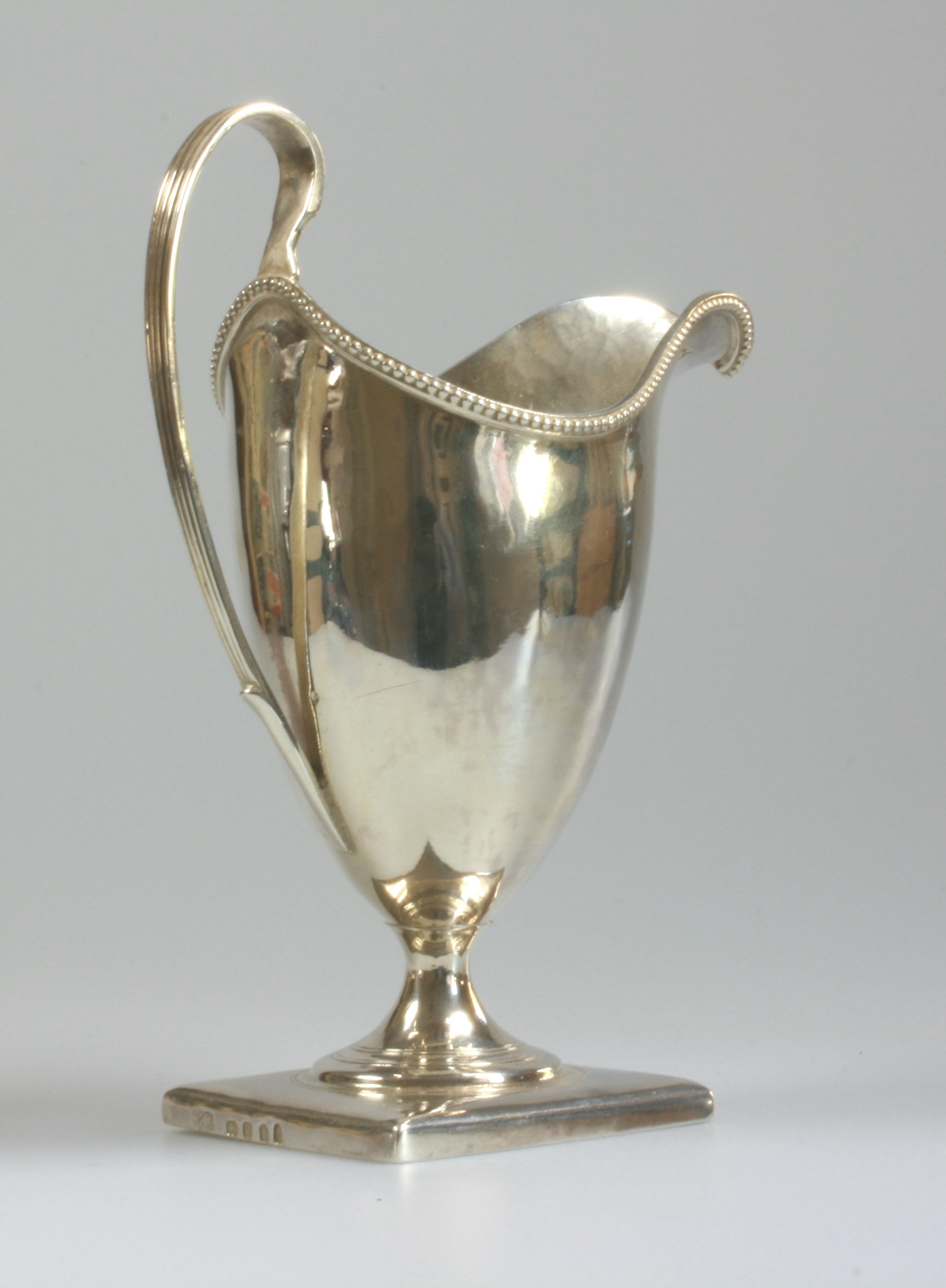 A George III Silver Helmet Shaped Cream Jug. George Cowles, London 1792. Engraved with initials