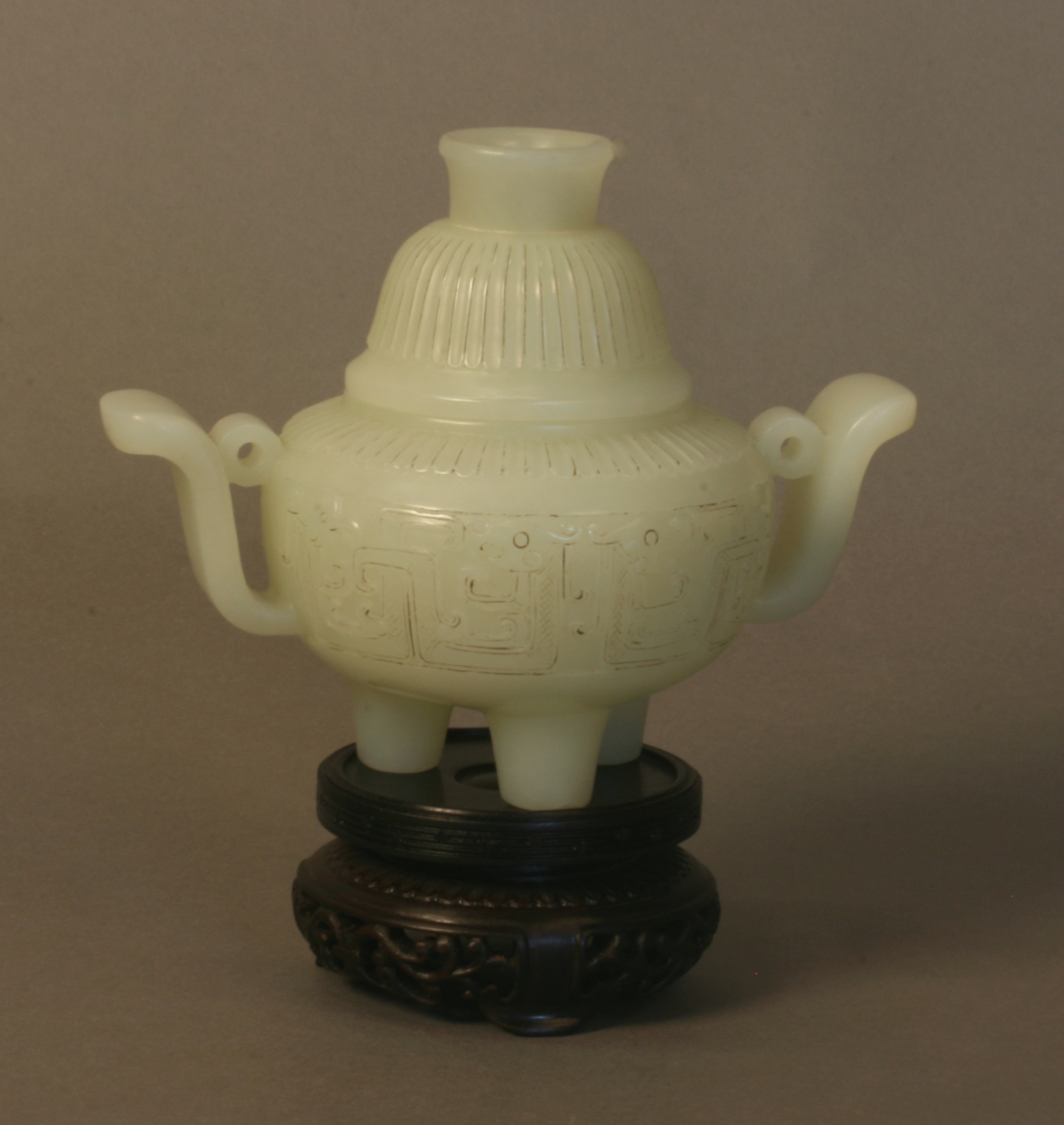 A Chinese Greenish White Tripod Jade Censer and cover. 19th century Qing Dynasty. The slightly