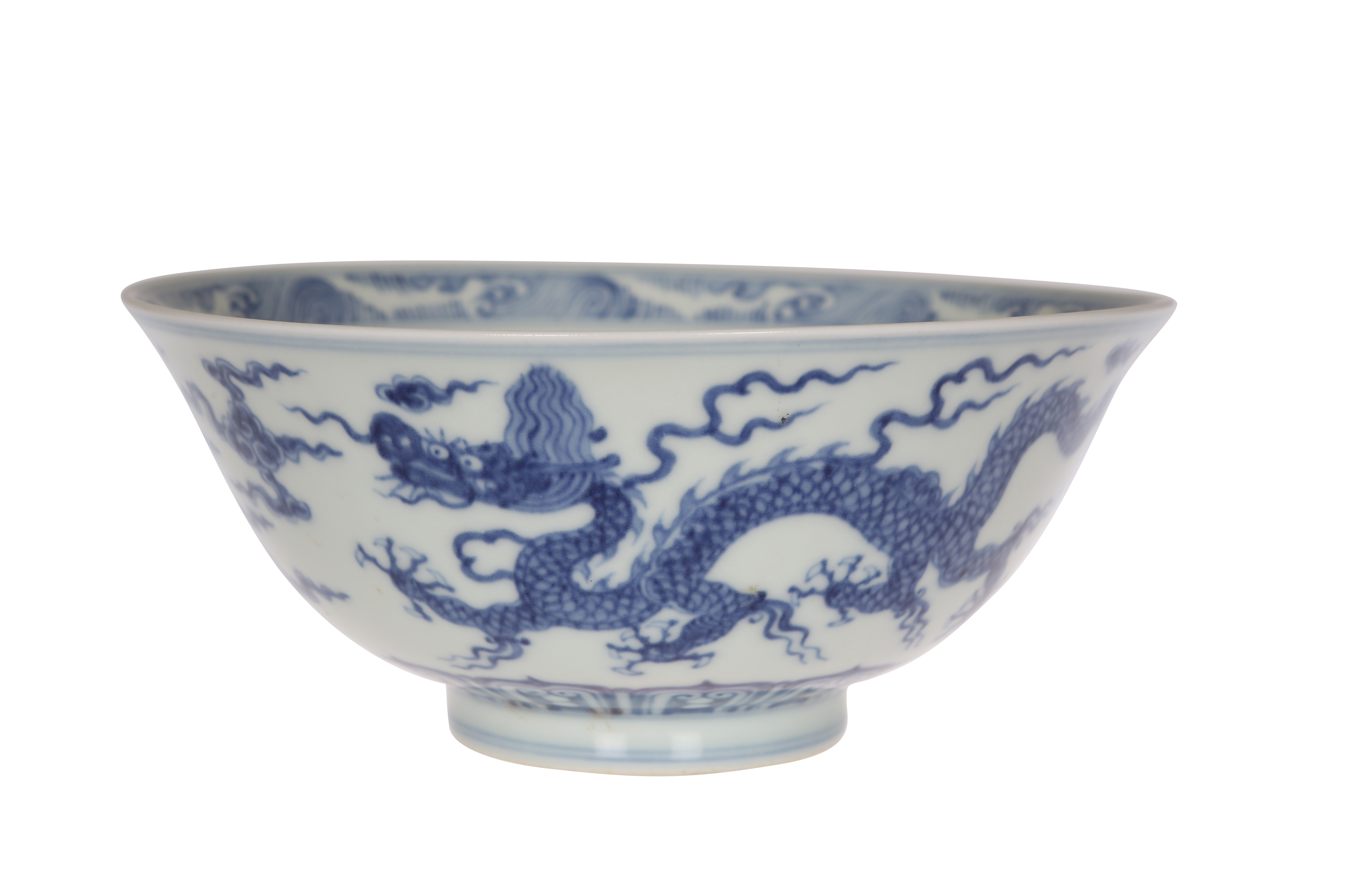 A Chinese blue and white porcelain bowl, painted to the exterior with two four-clawed dragons in