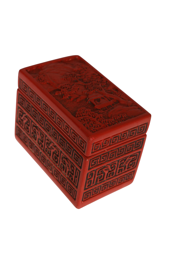 A Chinese cinnabar lacquer box and cover, rectangular, the cover carved with a figures in a pavilion