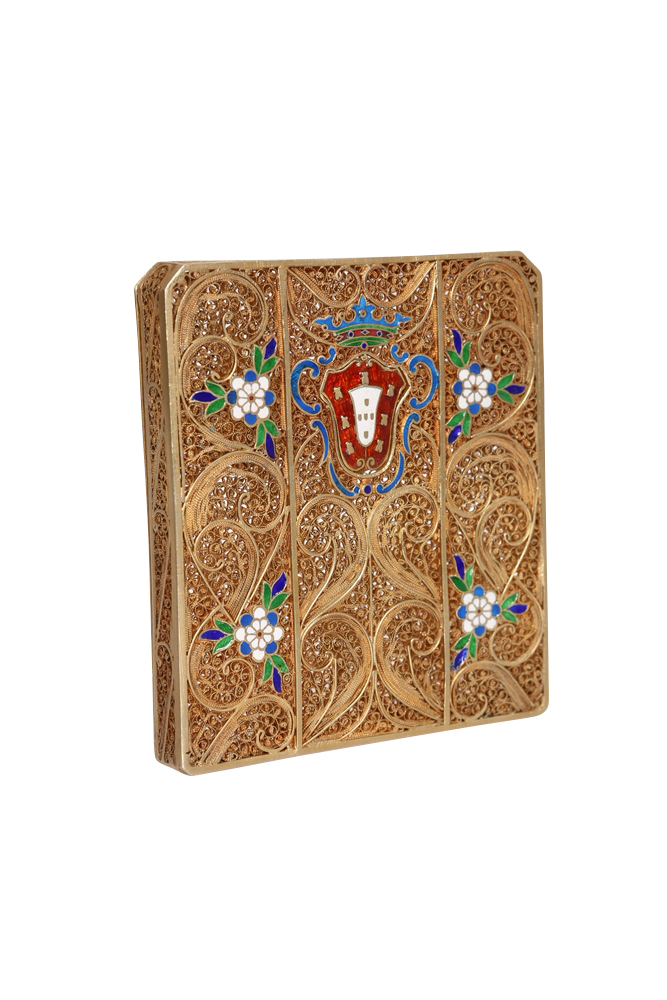 A vintage gilt filigree and enamel cigarette case, with hinged front, enamelled with flowerheads and