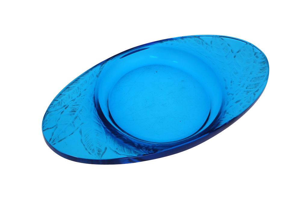 Lalique, a Feuilles pattern electric blue glass dish, the "wings" moulded with leaves, etched R.