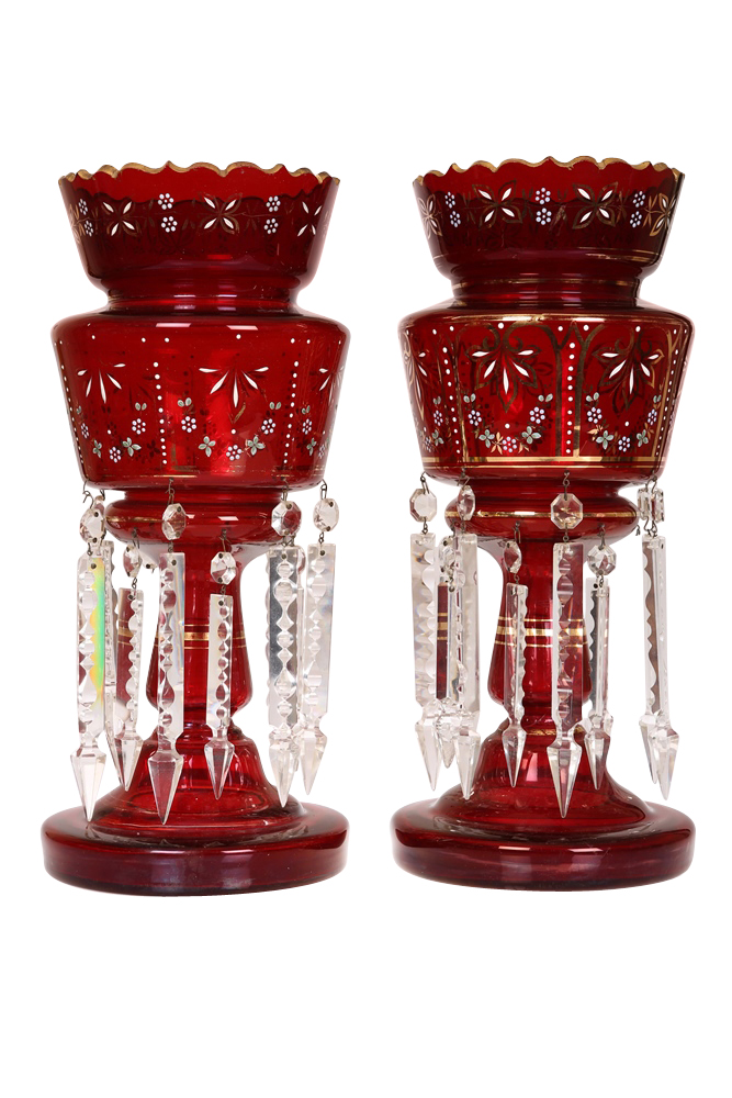 A pair of ruby glass table lustres, 19th Century, with crenellated tops, enamel painted and gilded