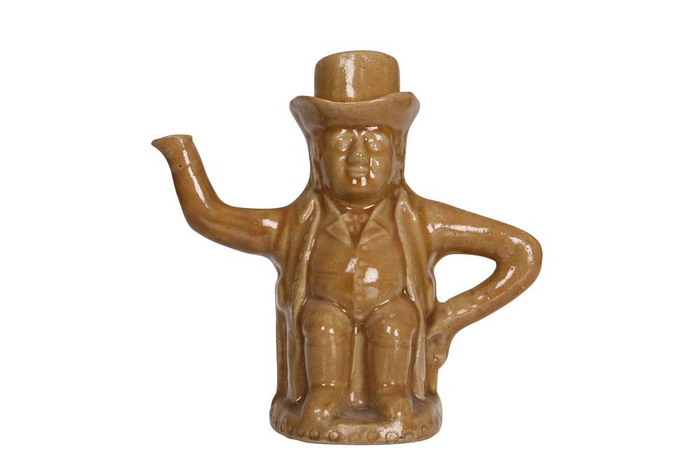 A salt-glazed pottery teapot, in the form of a toby, early 19th Century, the seated figure with