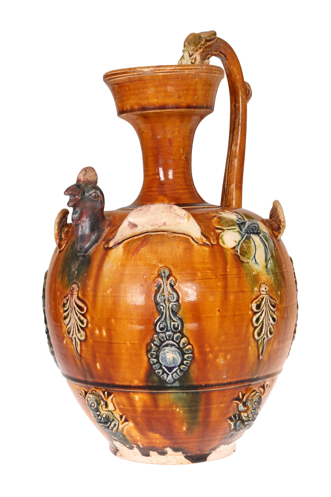 A Chinese chicken-head ewer, with chicken-head spout, applied with frogs and foliate motifs, with