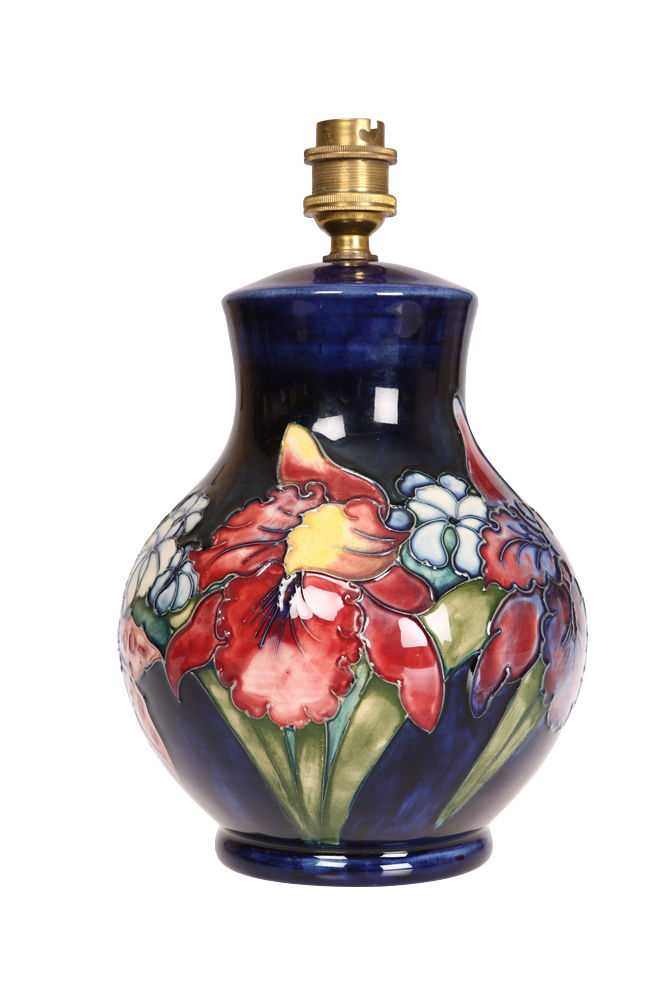 A Moorcroft pottery lamp base, c.1950, the squat baluster body tubelined and hand painted with