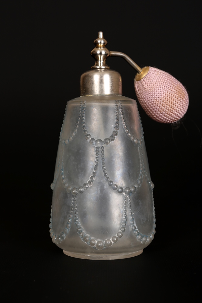 Lalique, a Perles pattern glass atomiser, the tapering body moulded with drapes of pearls, with blue