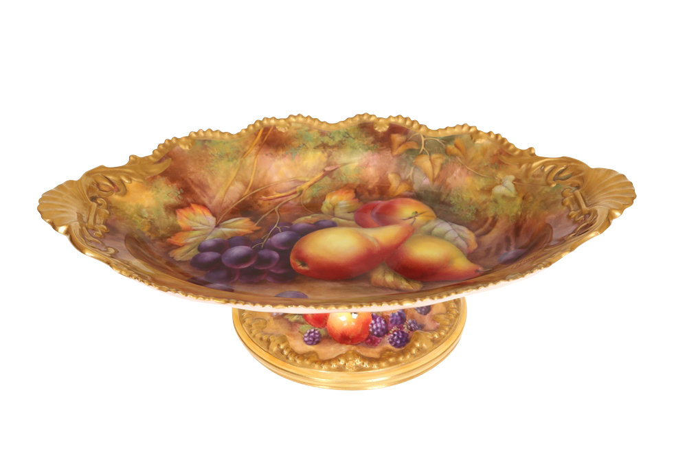 A Royal Worcester fruit painted porcelain comport, the dish of shaped oval form, the rim moulded