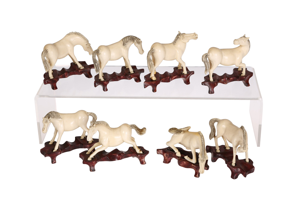 A set of eight Chinese carved ivory horses of Mu Wang, early 20th Century, modelled in various
