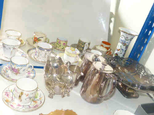 Collection of cabinet cups and saucers, silver plated basket, gravy boat, three piece tea set, etc