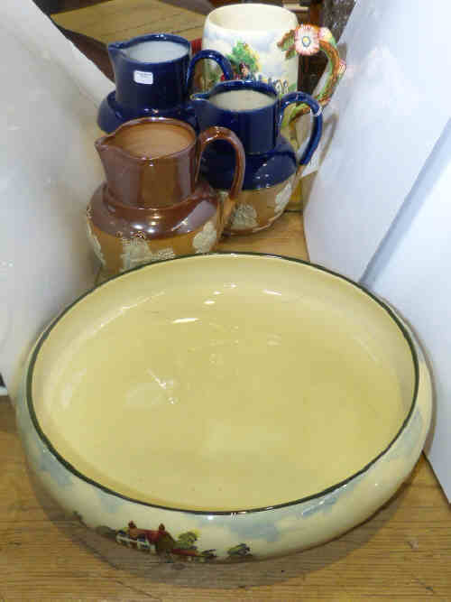 Royal Doulton Series Ware shallow bowl, three stoneware jugs, and Crown Devon 'Daisey Bell'