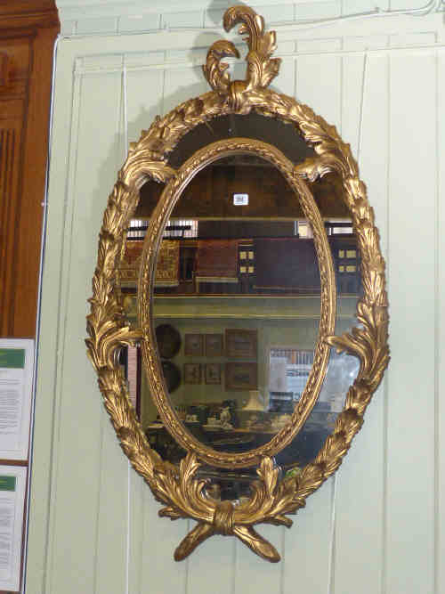 Ornate gilt framed oval wall mirror 130cm x 71cm