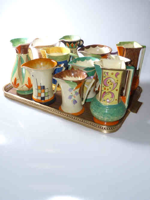 Collection of ten pieces of Myott hand-painted 1930's pottery including three Tunisian jugs, Doric