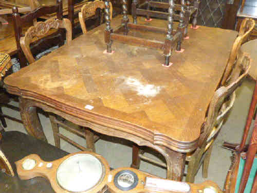 French oak draw leaf dining table and four fruitwood rush seated chairs