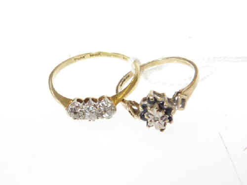 Three stone diamond ring, stamped 'PLAT' and '15', size Q; and a 9ct gold sapphire and diamond ring,