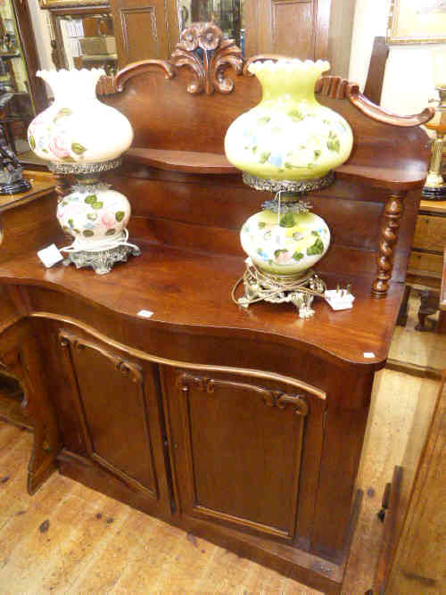 Victorian mahogany serpentine front two door chiffonier with raised back