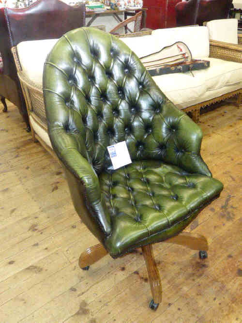 Green buttoned leather swivel desk chair