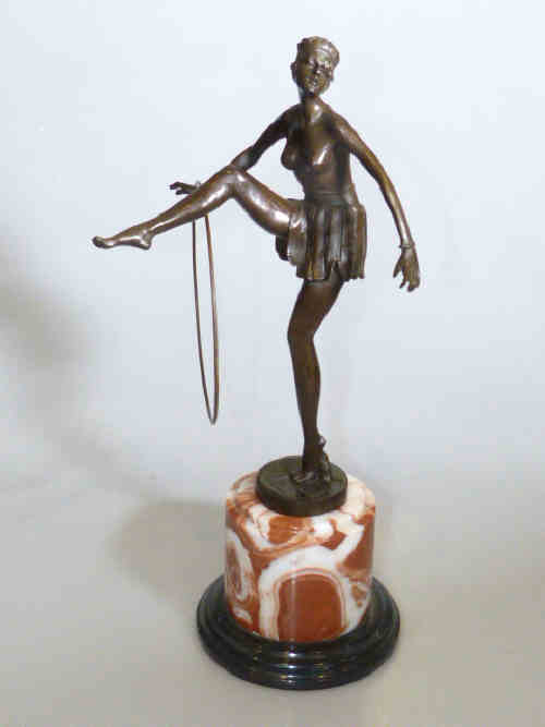 Modern bronze of semi clad dancer with hoop on marble base