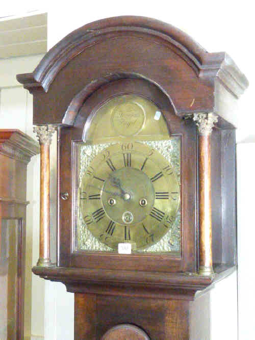 Antique oak cased eight day longcase clock having brass arched dial inscribed W. Turnbull,