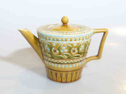 Linthorpe moulded and coloured glaze teapot, no. 1651