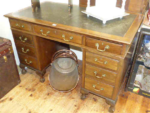 1920's mahogany pedestal desk on ball and claw feet