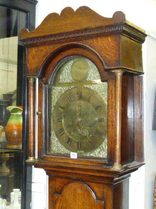 Antique oak cased eight day longcase clock having brass arched dial inscribed Cuthbert Darnton,