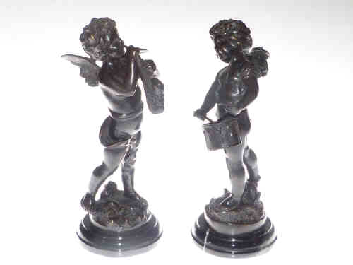 Pair of bronze putti playing musical instruments on marble base