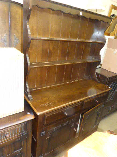 Oak shelf back dresser, four door cabinet bookcase, drop leaf dining table and four ladder back