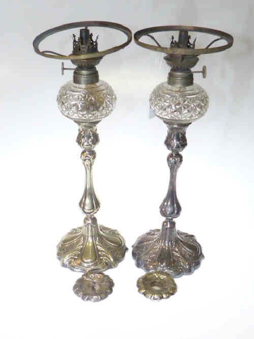 Pair Victorian silver plated candlesticks and oil lamps, with removable nozzles and crystal