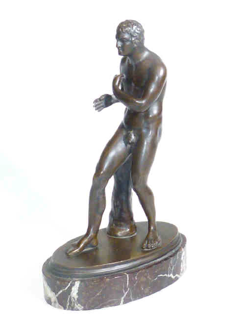 Bronze figure of naked male athlete on marble base