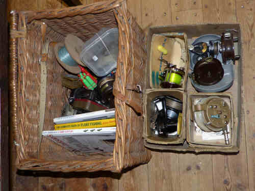 Wicker fishing basket, collection of reels, books, collection of rods etc