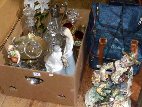 Capo di monte figure, box of decanters, claret jug, glasses, figurines, cutlery, pair of binoculars,
