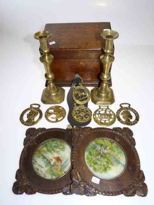 Oak box, pair ornate framed coloured prints, pair of brass candlesticks and horse brasses