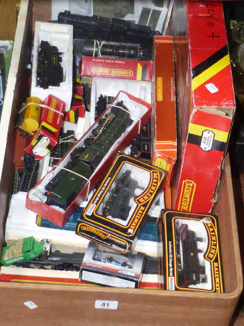 Box of twelve model railway engines and rolling stock including Mallard engine