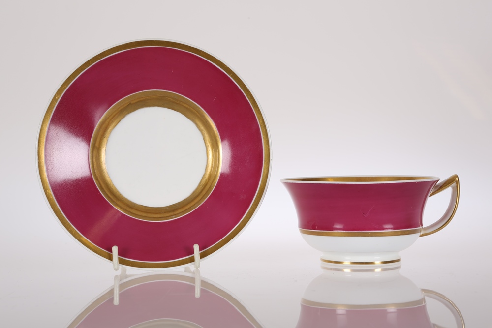 A Rockingham claret ground cup and saucer, circa 1826-30, with gilt borders, pattern no. 639, red