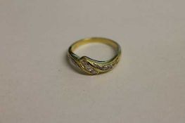 A nine stone diamond ring.   CONDITION REPORT:  Good condition, the shank not hallmarked but