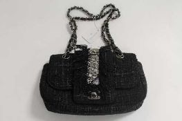 A Chanel hand bag in two-tone black.   CONDITION REPORT:  Good condition, no authenticity card.