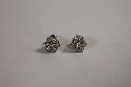 A pair of 18ct gold diamond cluster earrings. (2)   CONDITION REPORT:  Good condition.