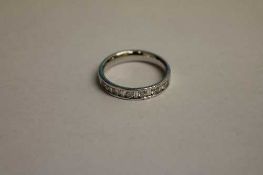 An 18ct white gold diamond half eternity ring.   CONDITION REPORT:  Good condition.